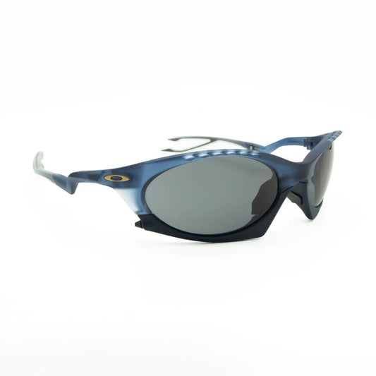 Occhiali da sole Oakley Plantaris OO9437 943709 Blue trasparente opaco