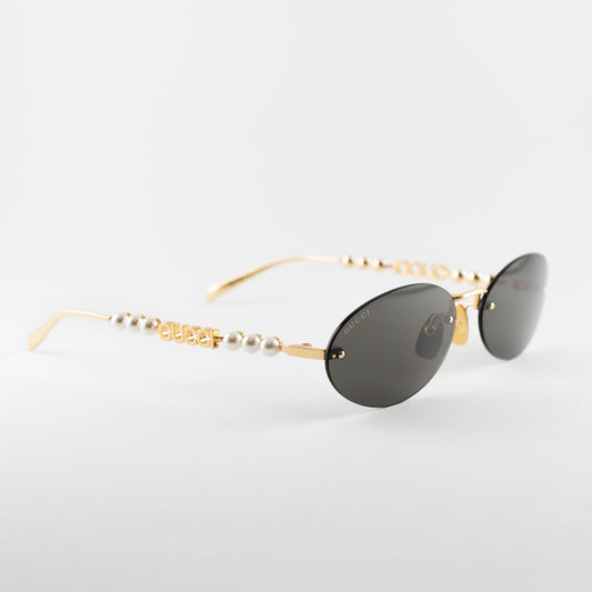 Occhiali da sole Gucci GG1922S 001 oro glasant